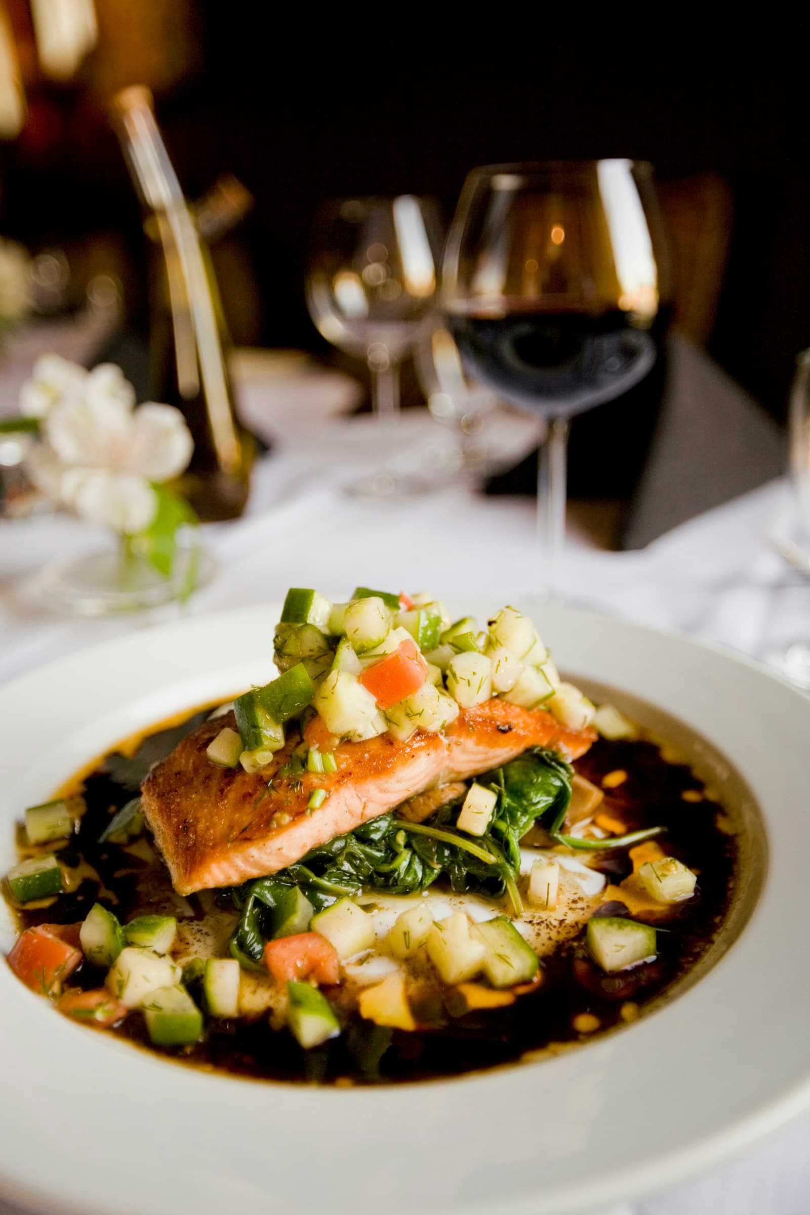 Plated fish entrée with red wine